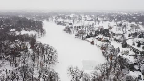 aerial, people skating on a homemade ice rink on a frozen lake