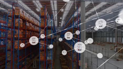 Animation-of-network-of-digital-icons-against-aerial-view-of-warehouse