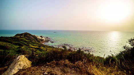 Sunny-ocean-coastline-with-gentle-waves---seascape-time-lapse