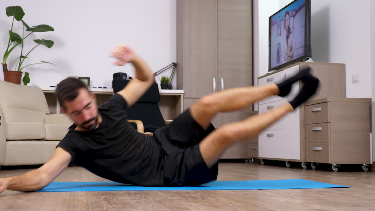 Man doing side plank exercise at home
