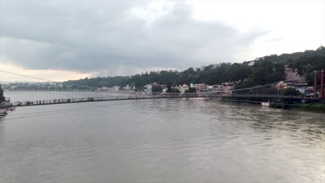 captivating aerial footage of the ganges river, showcasing its winding path through lush landscapes and the city of rishikesh