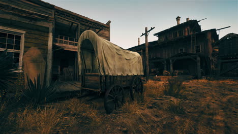 a covered wagon sits in front of a western town