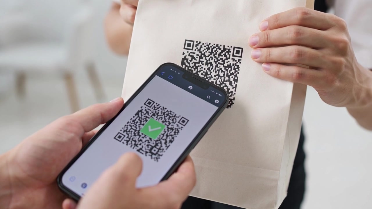 Customer Scanning QR Code on Paper Bag with Smartphone