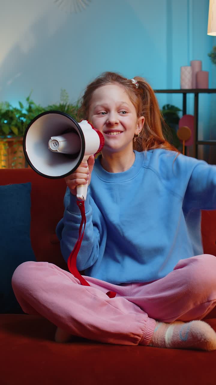 Preteen child girl kid talking with megaphone proclaiming news loudly announcing advertisement