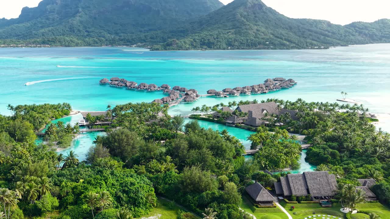Drone Shot of Bora Bora Island Luxury Tropical Resort, Bungalows and Lagoon, French Polynesia