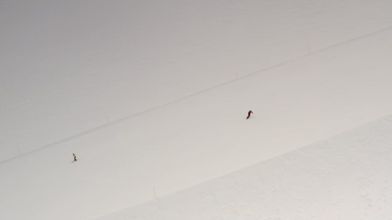 Skiers and snowboarder on a snowy slope