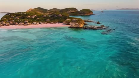 aerial view of a beautiful tropical island with white sand beach and turquoise water