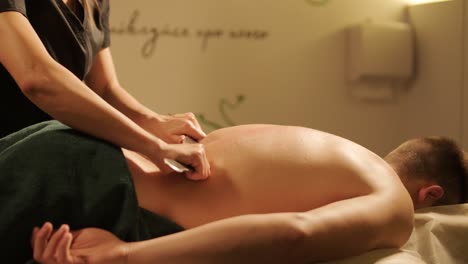 professional massage therapist performing relaxation massage