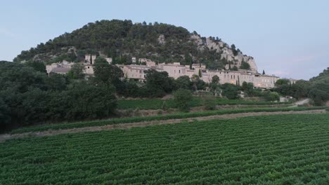 aerial drone shot vaucluse provence seguret medieval town vineyards sunset france