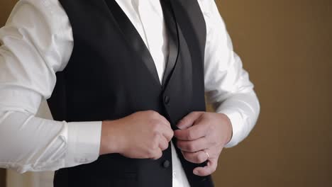 groom getting ready in a tuxedo