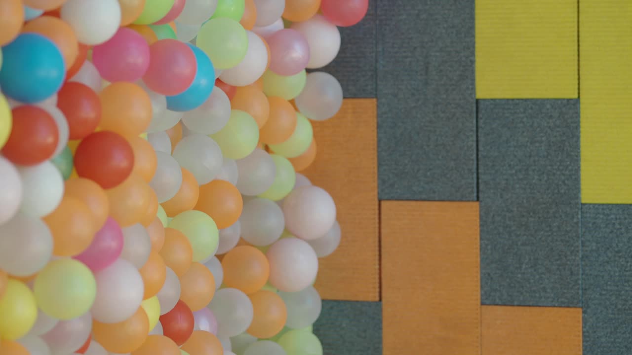 Colorful Balloons and Textured Wall Background