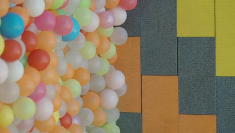colorful balloons and textured wall background