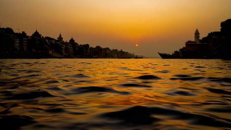 sunset over the ganges river in varanasi, india