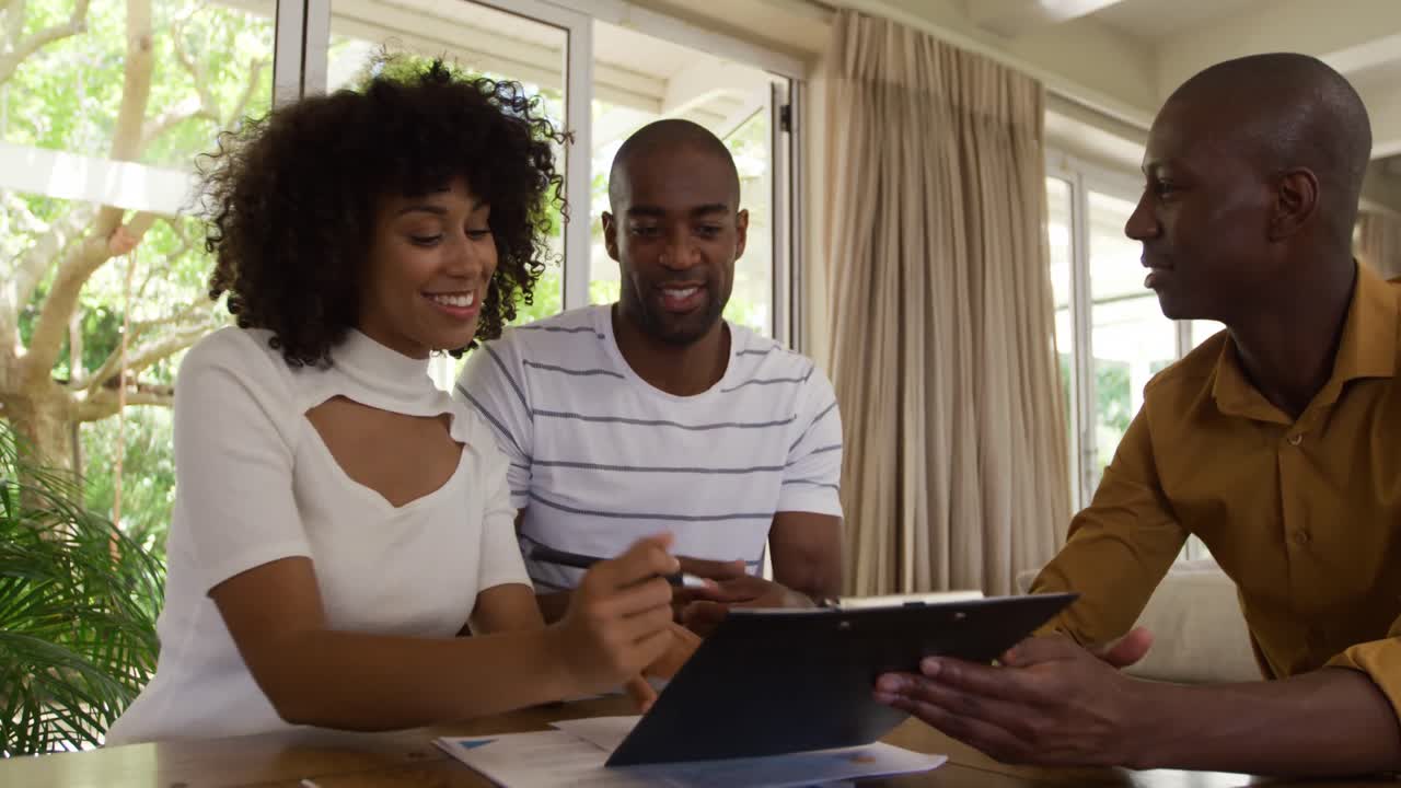 Mixed race couple buying their house