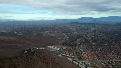 Aerial-view-truck-right-on-a-cloudy-day-in-the-city-of-Santiago,-Chile