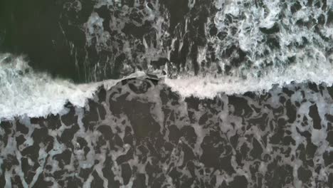 aerial top shot of waves on baltic sea in slow motion