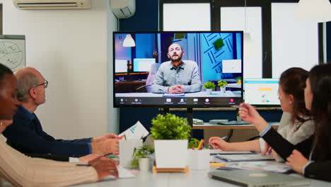 Manager-man-talking-with-colleague-using-video-call-for-virtual-meeting