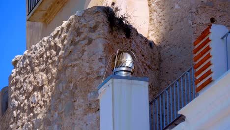chrome-plated rotating cover of a ventilation pipe, traditional national detail
