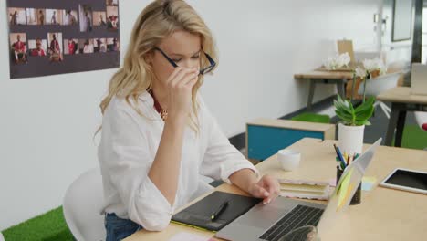 young woman working in a creative office