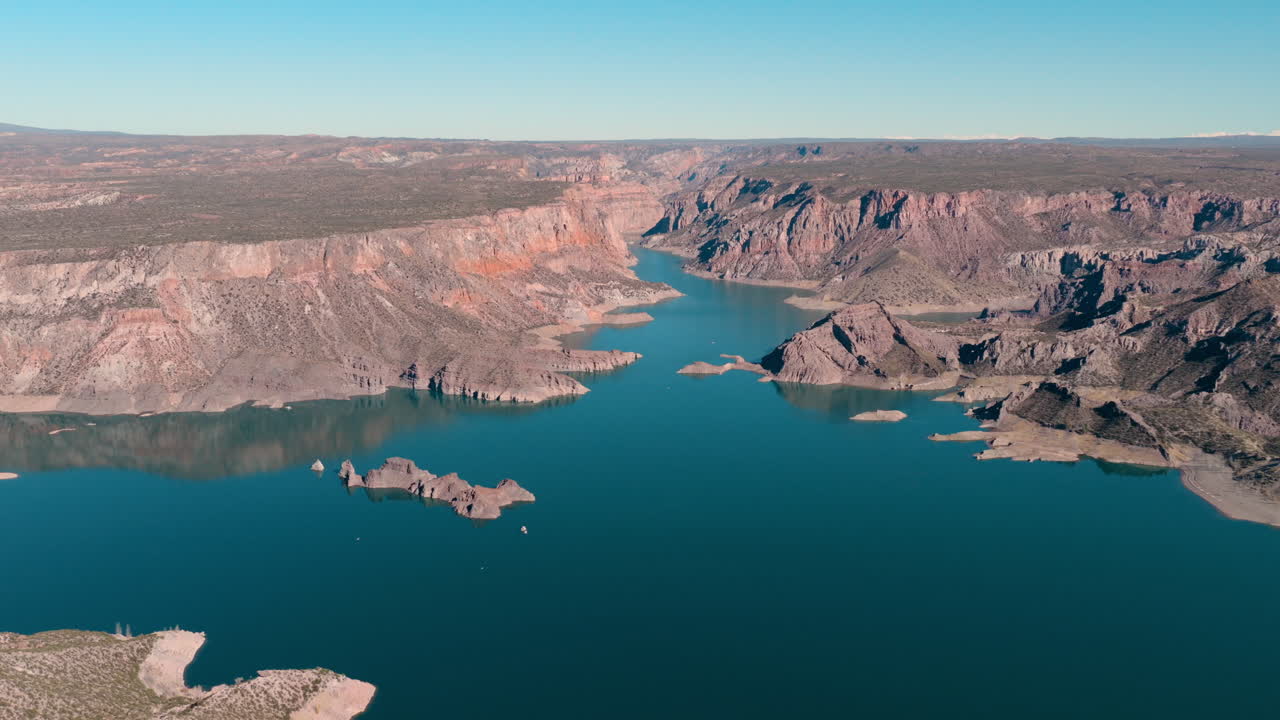 Drone view of Atuel Canyon rock formations and pristine calm waters below, Mendoza, Argentina
