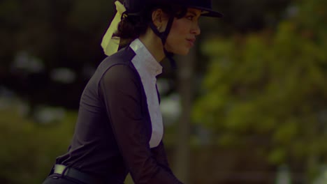 Happy-female-jockey-on-a-competition-day,-slow-motion