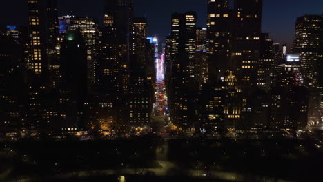 7th avenue and central park, nighttime in midtown, manhattan, ny - aerial view