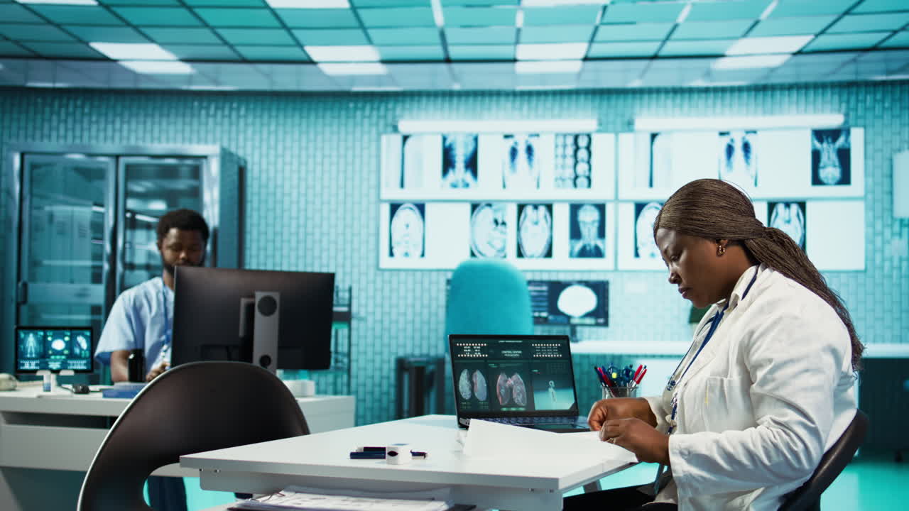 African american woman doctor explaining radiology results to a girl
