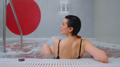 woman relaxing in a hot tub