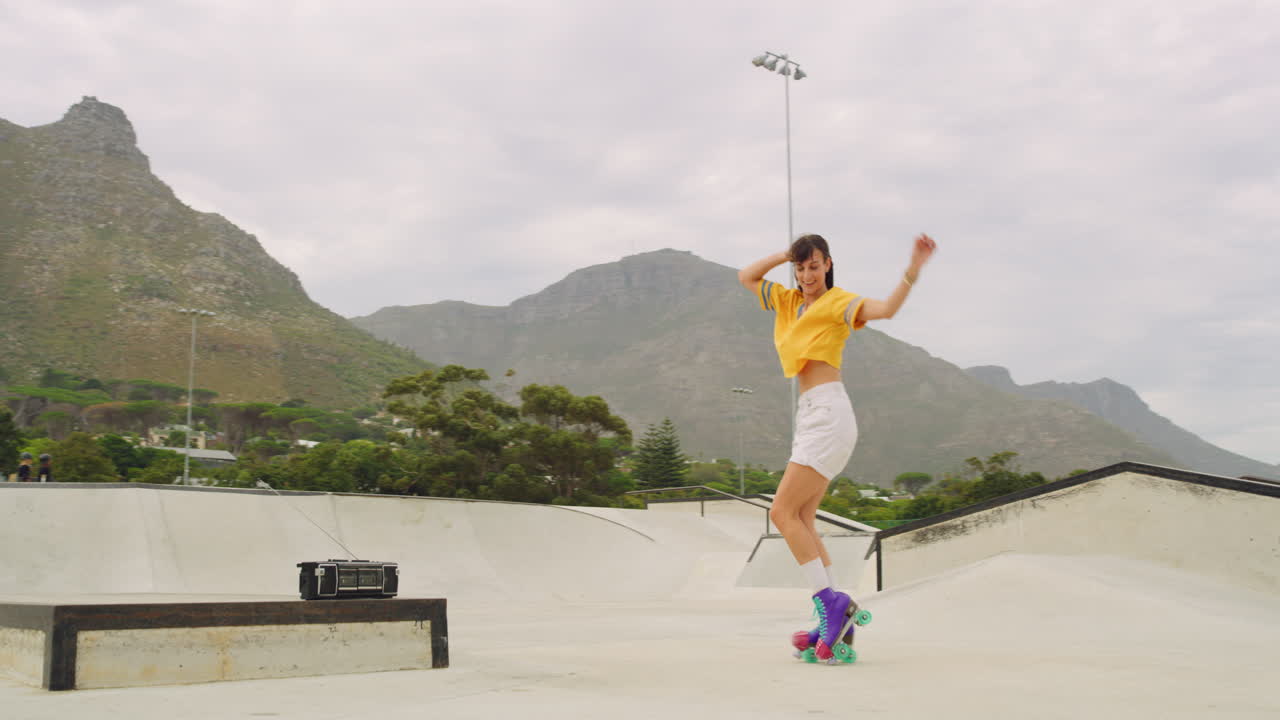 One cheerful female roller skater dancing