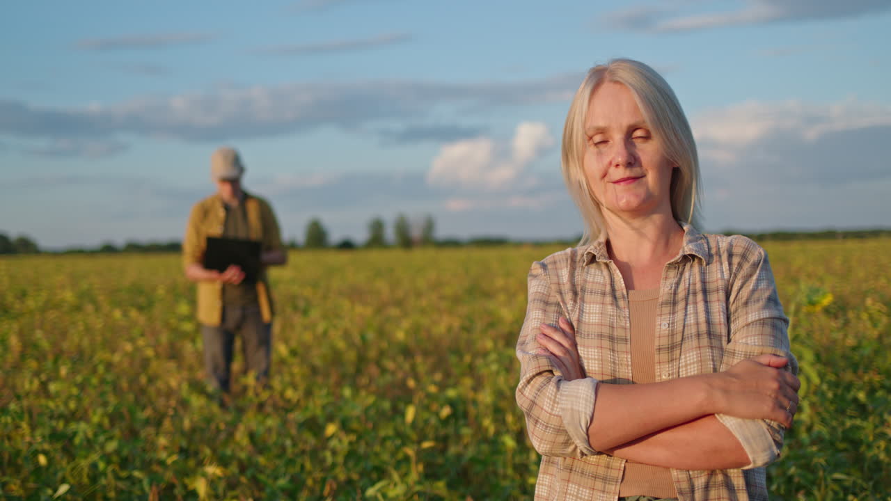 Woman farmer in a soybean field