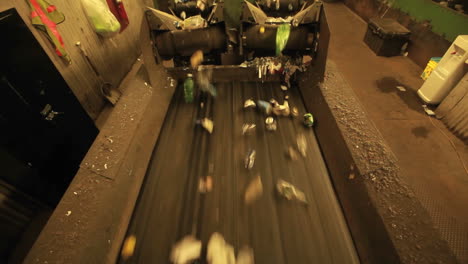 recycling materials move along a conveyor belt in a factory