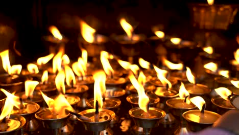 burning candles at the buddhist temple in Nepal