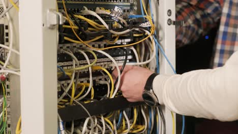 technician configures the network equipment in the server room