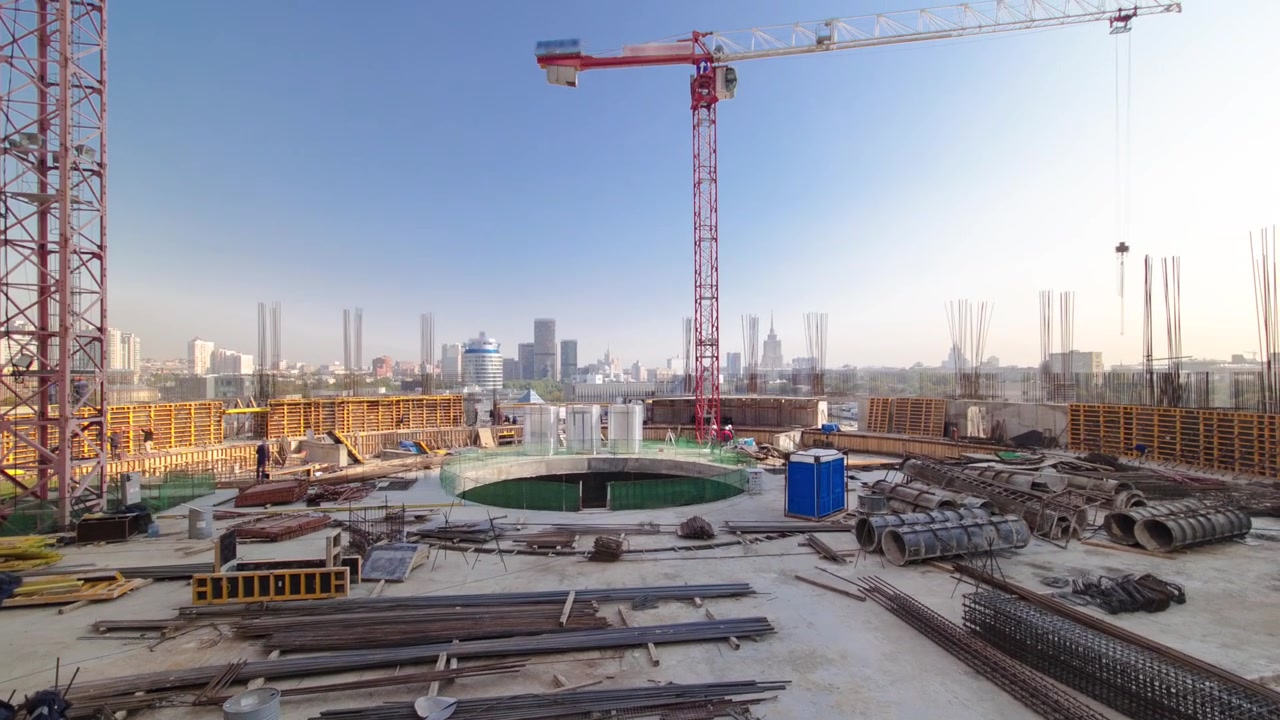 Construction site on which to build high-rise buildings timelapse hyperlapse. Moscow panorama on background