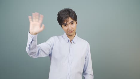 happy man waving at camera.