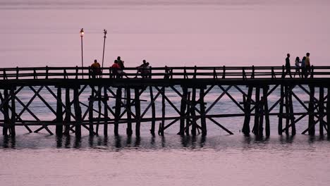 the mon bridge is an old wooden bridge located in sangkla, thailand