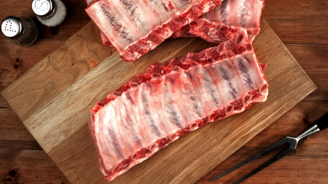 Fresh Raw Pork Ribs on a Wooden Cutting Board
