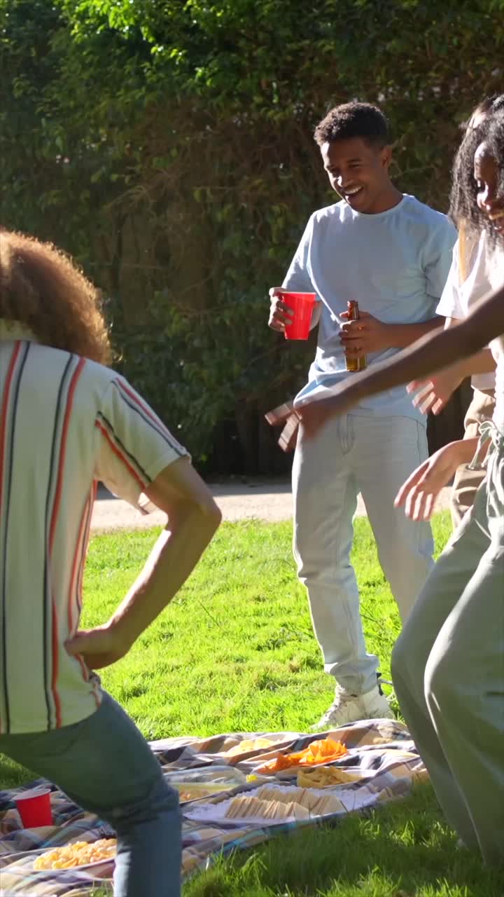 A group of friends playing a lawn game