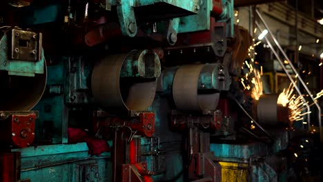 Automated welding machine in a workshop of a steel wheel production plant.