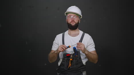 construction worker inspecting tools