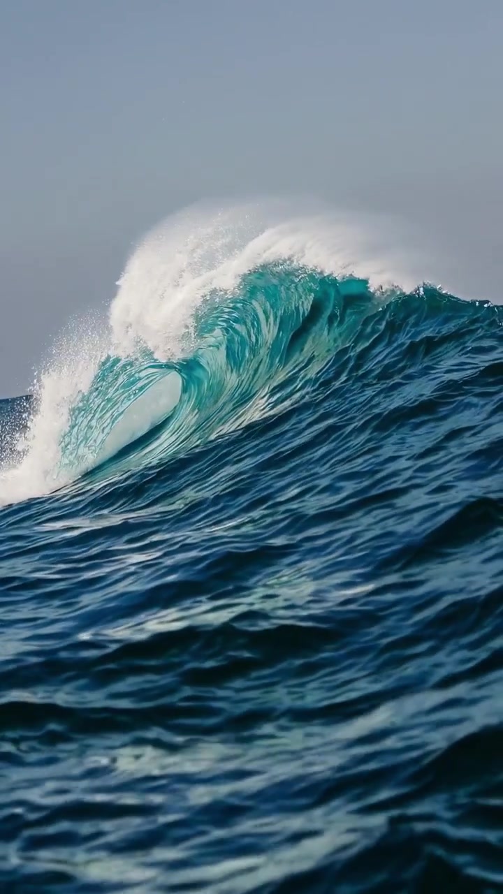 Powerful Blue Ocean Wave Breaking with White Foam