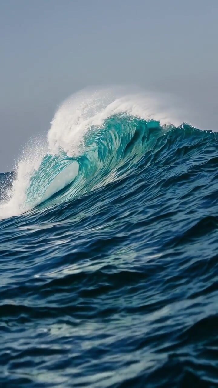 Powerful Blue Ocean Wave Breaking with White Foam