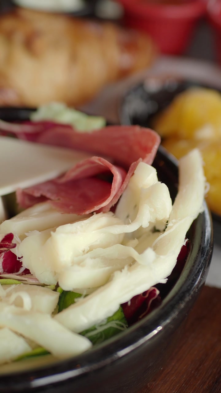 Close-up of a Delicious Breakfast Spread with Olives, Cheese, and Orange Slices