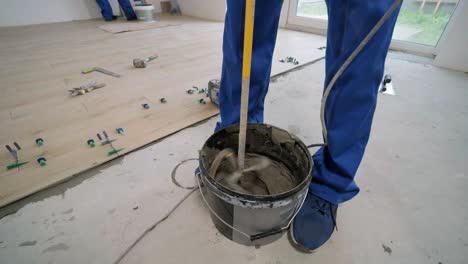 installing ceramic floor tiles - measuring and cutting the pieces. construction, renovation, repair apartment. cuts tile. tile cutting