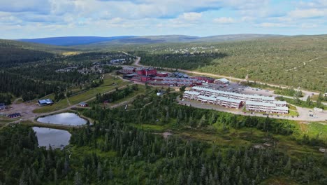 flying towards salens hogfjallshotell in dalarna, sweden at daytime - aerial drone shot