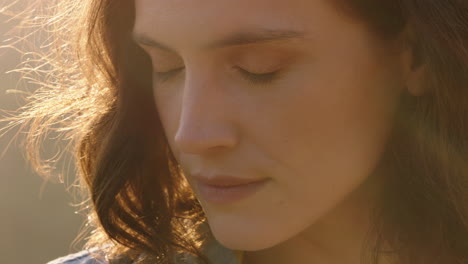 close up portrait of beautiful woman enjoying peaceful sunset exploring spirituality looking up praying contemplating journey with wind blowing hair