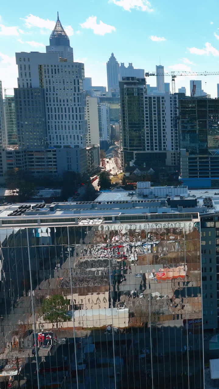 Downtown Atlanta Skyscrapers. Business center mirror reflection in windows of skyscraper. Blue sky, autumn landscape. Aerial view Atlanta Buckhead. Vertical