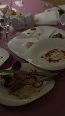 leftover food after party, dirty food. after banquet is finished. concept of the restaurant business. vertical video