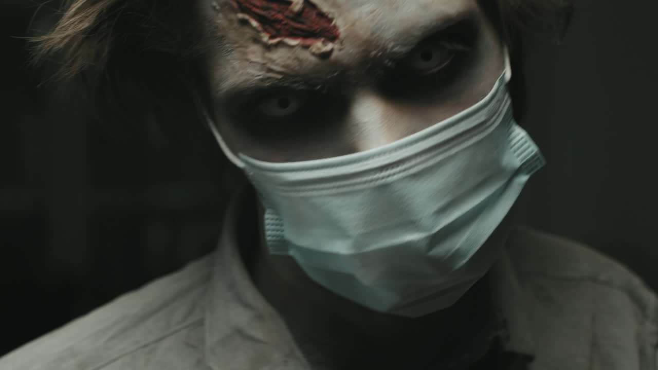 Zombie in Face Mask Twitching before Camera