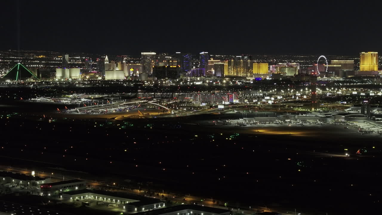 Las Vegas Nevada Aerial v118 zoomed flyover paradise capturing airport runway and Strip's cityscape, highlighting the vibrant nightlife of the desert city - Shot with Mavic 3 Pro Cine - May 1st 2024